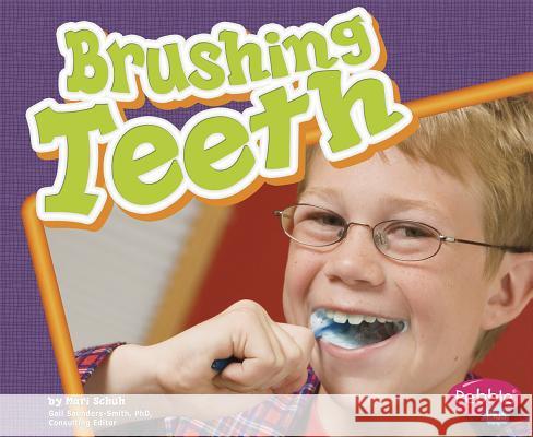 Brushing Teeth Mari C. Schuh 9781429617864 Pebble Plus - książka