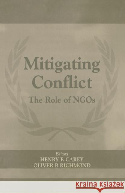 Mitigating Conflict: The Role of Ngos Carey, Henry F. 9780714654300 Frank Cass Publishers