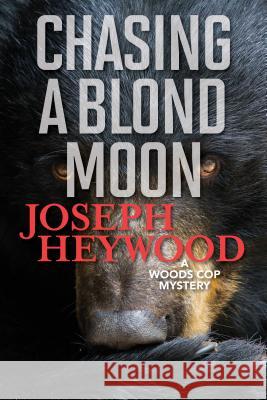 Chasing a Blond Moon: A Woods Cop Mystery Joseph Heywood 9781493040513 Lyons Press