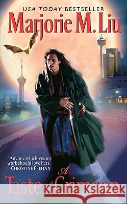 A Taste of Crimson Marjorie M. Liu 9780062019844 Avon Books - książka