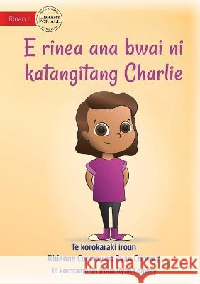 Charlie Chooses and Instrument - E rinea ana bwai ni katangitang Charlie (Te Kiribati) Rhianne Conway Ryan Conway Ryan Conway 9781922835574 Library for All - książka