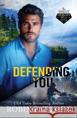 Defending You: The Bodyguard and His Former Crush Escape to Shadow Cove Robin Patchen 9781950029655 Jdo Publishing - książka