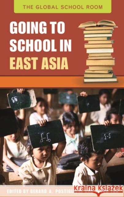 Going to School in East Asia Gerard A. Postiglione Jason Tan 9780313336331 Greenwood Press - książka
