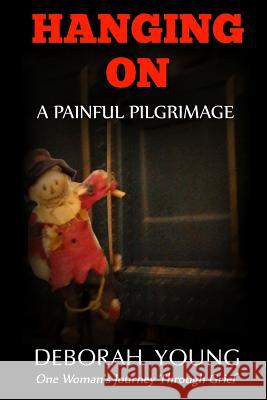 Hanging On - A Painful Pilgrimage: One Woman's Journey Through Grief Young, Deborah 9781942731184 M&b Global Solutions - książka