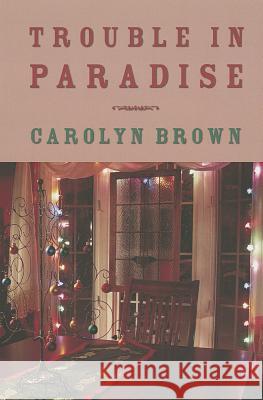 Trouble in Paradise Carolyn Brown 9781477813041 Amazon Publishing - książka