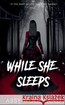 While She Sleeps Abby Woodland 9798223232438 Abby Woodland - książka